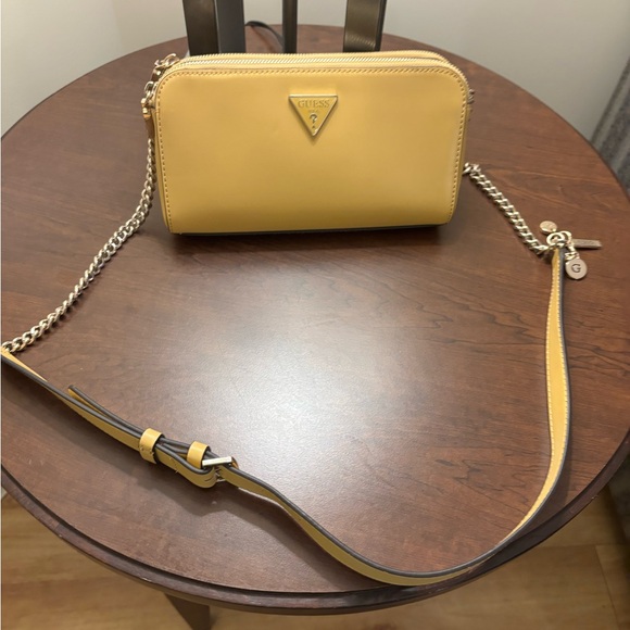 Guess Handbags - GUESS soft yellow Crossbody Bag with Chain Strap